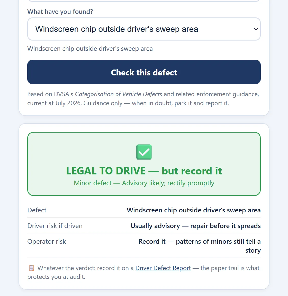 The defect checker returning a minor defect for a windscreen chip outside the driver's sweep area: legal to drive, advisory likely, rectify promptly.